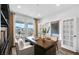 Bright home office with a large window, stylish desk, and elegant French doors at 2905 Medford Drive, Cumming, GA 30041