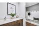 Bright mudroom with a white bench, hooks, cabinets, countertop and hardwood floors at 2905 Medford Drive, Cumming, GA 30041
