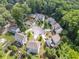 Aerial view of a neighborhood with houses surrounded by lush greenery at 3998 Commodore Dr, Atlanta, GA 30341