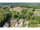 Ariel view of a newly constructed neighborhood surrounded by lush trees and serene landscape at 3998 Commodore Dr, Atlanta, GA 30341
