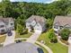 Aerial view of a beautiful home with a well-maintained lawn and a paved driveway at 3998 Commodore Dr, Atlanta, GA 30341