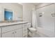 Bathroom with white cabinets, granite countertop, and a bathtub with shower at 3998 Commodore Dr, Atlanta, GA 30341