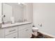 Bright bathroom boasts white vanity with granite countertop and modern fixtures at 3998 Commodore Dr, Atlanta, GA 30341