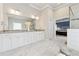 Spacious bathroom vanity with white cabinets, granite countertop and large mirror at 3998 Commodore Dr, Atlanta, GA 30341