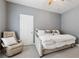 Serene bedroom with comfortable chair, neutral walls, and inviting bed with plush pillows at 3998 Commodore Dr, Atlanta, GA 30341