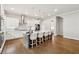 Bright kitchen boasts stainless appliances, white cabinets, gray island, and hardwood floors at 3998 Commodore Dr, Atlanta, GA 30341
