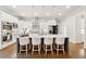 This gorgeous kitchen features stainless appliances, white cabinets, and an island with seating at 3998 Commodore Dr, Atlanta, GA 30341