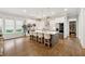 Modern kitchen featuring a large island with seating, stainless steel appliances, and hardwood floors at 3998 Commodore Dr, Atlanta, GA 30341