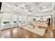 Bright living room with coffered ceiling, hardwood floors, and many windows at 3998 Commodore Dr, Atlanta, GA 30341
