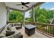 Relaxing covered patio features outdoor seating area, ceiling fan, and views of the backyard at 3998 Commodore Dr, Atlanta, GA 30341