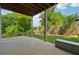 Covered patio overlooking a well-manicured lawn, ideal for relaxing and enjoying the outdoors at 3998 Commodore Dr, Atlanta, GA 30341