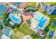 Scenic aerial view of the community center, showcasing pools, a playground, and parking at 1313 Cobblestone Ln, Woodstock, GA 30189