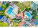 Gorgeous aerial view of the community center with swimming pools, tennis courts, and luscious landscaping at 1313 Cobblestone Ln, Woodstock, GA 30189