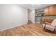 Finished basement area with wood-look floors, built-in cabinets, and stairs at 1313 Cobblestone Ln, Woodstock, GA 30189