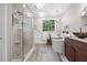 Elegant bathroom with glass shower, soaking tub, and double vanities at 1313 Cobblestone Ln, Woodstock, GA 30189