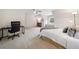 Spacious bedroom with a ceiling fan, window seat, and room for a study area at 1313 Cobblestone Ln, Woodstock, GA 30189