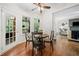 Cozy breakfast nook features a dining table and chairs with views of the living area at 1313 Cobblestone Ln, Woodstock, GA 30189