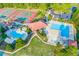 Aerial view showcasing a community pool, tennis courts, and landscaping at 1313 Cobblestone Ln, Woodstock, GA 30189