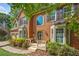 Charming brick home featuring a welcoming porch and manicured landscaping at 1313 Cobblestone Ln, Woodstock, GA 30189
