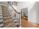 Inviting foyer with a staircase and hardwood floors leading to other rooms at 1313 Cobblestone Ln, Woodstock, GA 30189