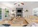 Inviting living area featuring hardwood floors and a decorative fireplace with accent wall at 1313 Cobblestone Ln, Woodstock, GA 30189