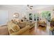 Spacious living room featuring hardwood floors and views of the backyard at 1313 Cobblestone Ln, Woodstock, GA 30189