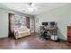 Comfortable home office with a large window, hardwood flooring, and ample seating at 1313 Cobblestone Ln, Woodstock, GA 30189