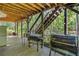 Covered outdoor kitchen with grill area for backyard entertainment at 1313 Cobblestone Ln, Woodstock, GA 30189