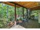 Cozy outdoor patio area with a grill and dining set for relaxed outdoor living at 1313 Cobblestone Ln, Woodstock, GA 30189