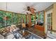 Charming screened porch featuring tile floors and wooded views at 1313 Cobblestone Ln, Woodstock, GA 30189