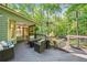 Relaxing upper deck with outdoor seating, heater, and a screened-in porch at 1313 Cobblestone Ln, Woodstock, GA 30189