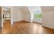 Bedroom with beautiful hardwood floors, closet, and bright windows offering great natural light at 1482 N Decatur Ne Rd, Atlanta, GA 30306