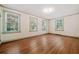 Spacious bedroom features three windows and hardwood floors at 1482 N Decatur Ne Rd, Atlanta, GA 30306