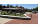 Charming brick commercial building with inviting storefronts and landscaping on a sunny day at 1482 N Decatur Ne Rd, Atlanta, GA 30306