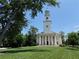 Elegant white church with a tall steeple, surrounded by green lawns and mature trees at 1482 N Decatur Ne Rd, Atlanta, GA 30306