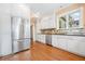 Bright kitchen featuring stainless steel appliances, white cabinets and granite countertops at 1482 N Decatur Ne Rd, Atlanta, GA 30306