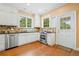 Kitchen features white cabinets, granite counters, stainless steel appliances and tile backsplash at 1482 N Decatur Ne Rd, Atlanta, GA 30306