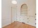 Room featuring hardwood floors and built-in cabinets and shelving at 1482 N Decatur Ne Rd, Atlanta, GA 30306