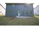 Back exterior view of home with a concrete patio at 2307 Overlook Ave, Lithonia, GA 30058