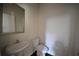A half bath with a pedestal sink at 2307 Overlook Ave, Lithonia, GA 30058