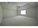 Spacious bedroom showcasing trey ceilings, a fan, and a window with natural light at 2307 Overlook Ave, Lithonia, GA 30058