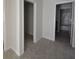 Neutral bedroom featuring neutral paint, plush carpet, and a view to the bathroom at 2307 Overlook Ave, Lithonia, GA 30058