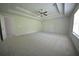 Bright Primary bedroom with trey ceilings, a fan, and a view to the bath at 2307 Overlook Ave, Lithonia, GA 30058