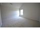 Bedroom with carpet, white walls, and window at 2307 Overlook Ave, Lithonia, GA 30058