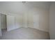 A cozy bedroom with neutral walls and carpet, featuring 2 door ways at 2307 Overlook Ave, Lithonia, GA 30058