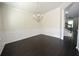 Dining room showcasing hardwood flooring and decorative wall molding at 2307 Overlook Ave, Lithonia, GA 30058