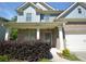 Charming two-story home with brick and siding and a well-manicured front yard at 2307 Overlook Ave, Lithonia, GA 30058