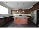 Modern kitchen featuring granite countertops, large island, and stainless steel appliances at 2307 Overlook Ave, Lithonia, GA 30058