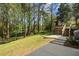 Sprawling backyard with lush greenery, mature trees, and a spacious deck at 5725 Brenda Sw Dr, Mableton, GA 30126