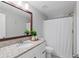 Bathroom featuring a vanity with granite countertop and a shower with white curtain at 5725 Brenda Sw Dr, Mableton, GA 30126